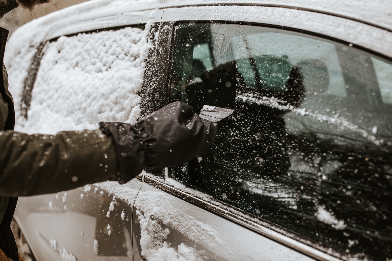 scraping snow from car window