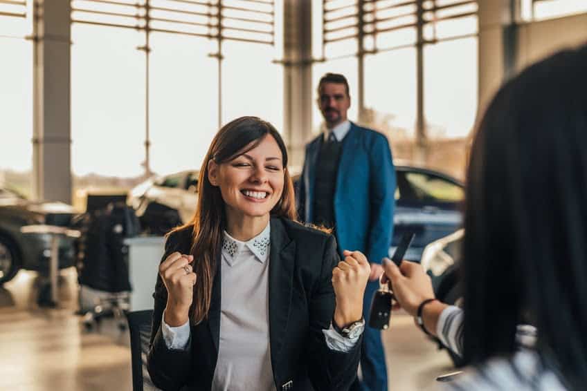 Young Women Happy Buying a Car