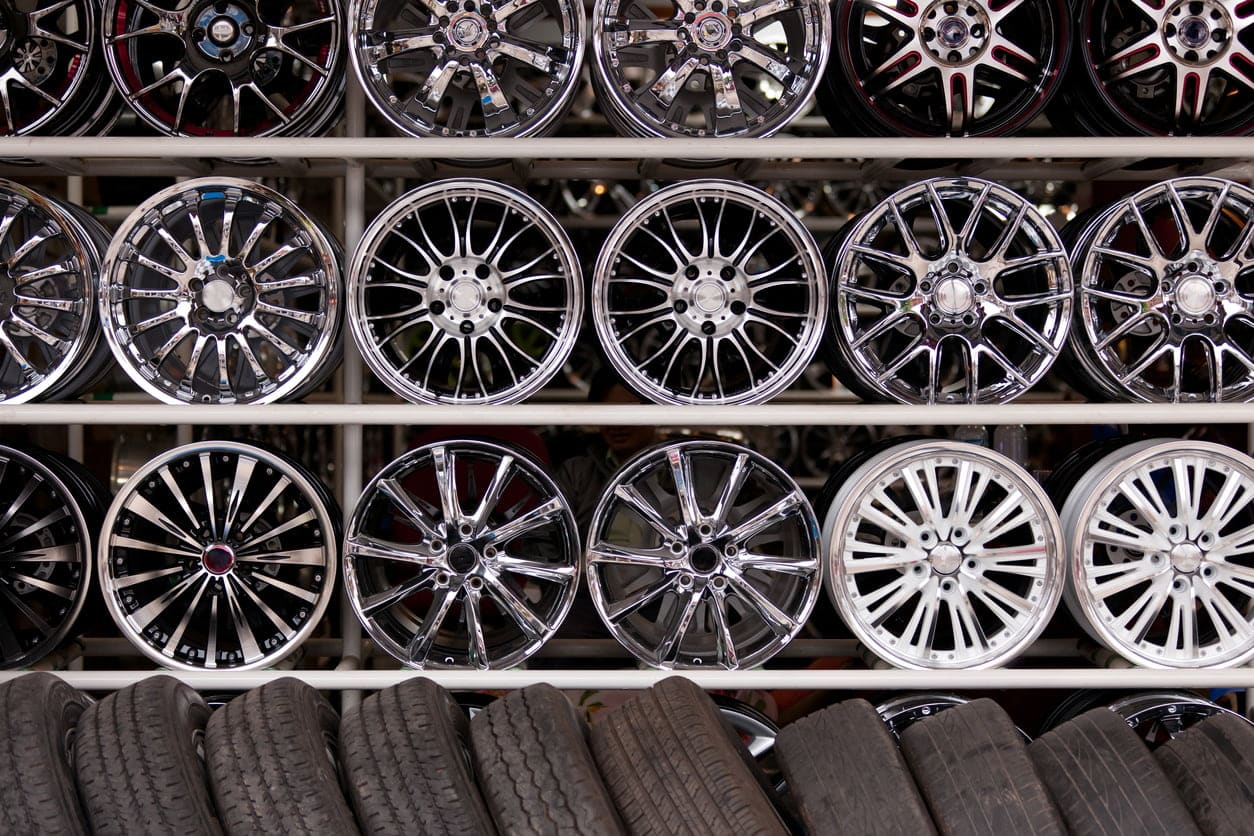 wall of alloy car wheels and pneumatic tires in store