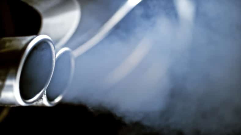 Smoke emission from exhaust pipe of car.