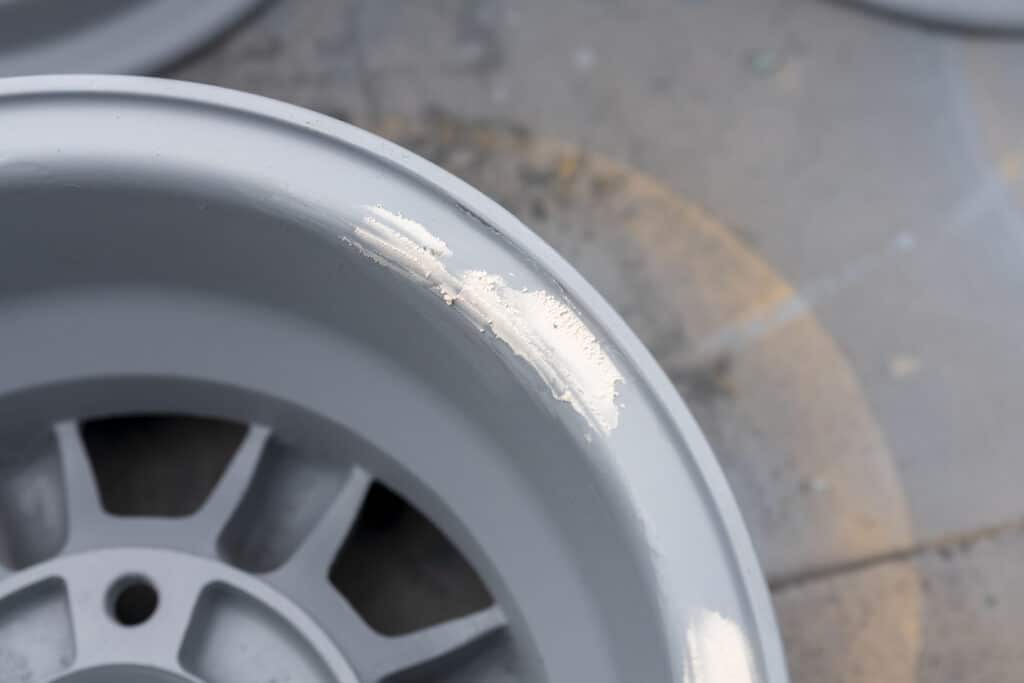 These are the wheel. This is a close-up of the rim after an initial clean and sand and with a coat of primer applied and some filler drying setting on the deepest scratches.