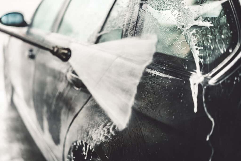 Black car being jet washed