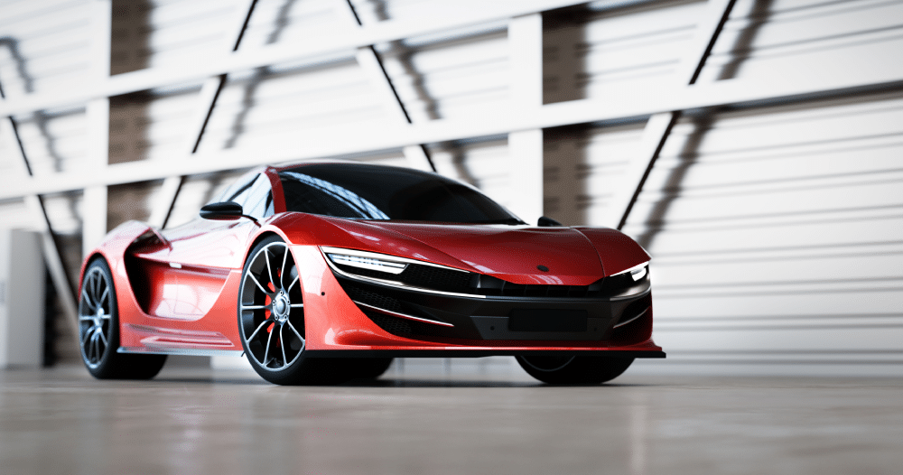 Red supercar sat stationary in a warehouse